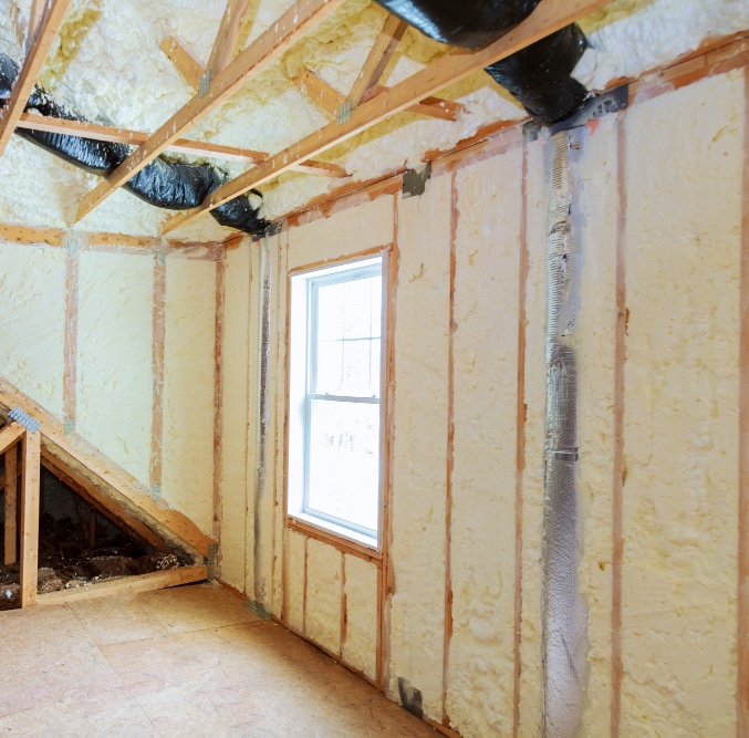 new home build insulation Corowa Spray foam insulation in the walls of a room under construction beside a window